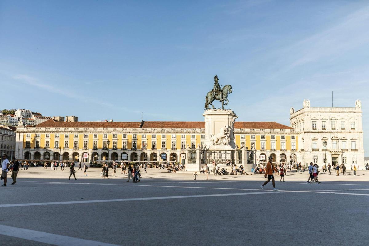 a large building with a statue in front of it