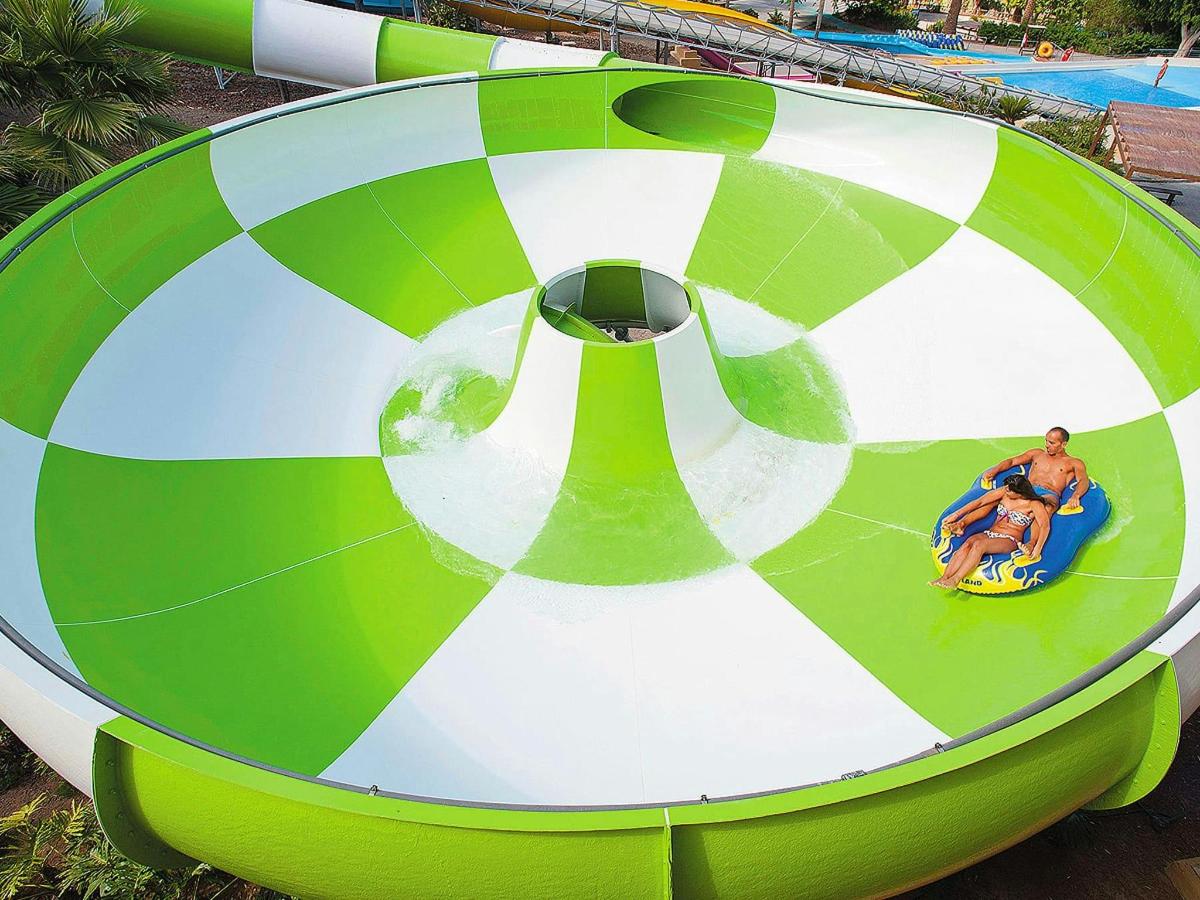 a group of people riding on a ride at a water park