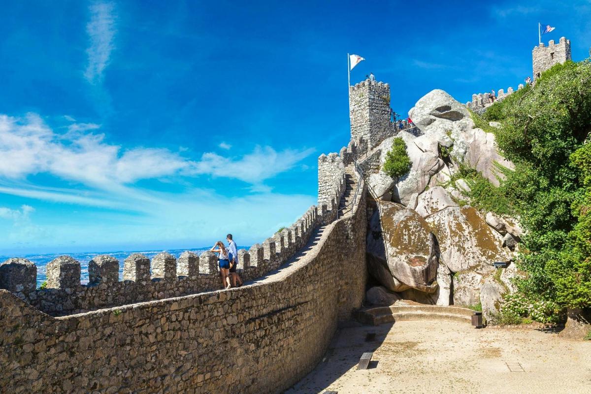 a man standing on the great wall of china