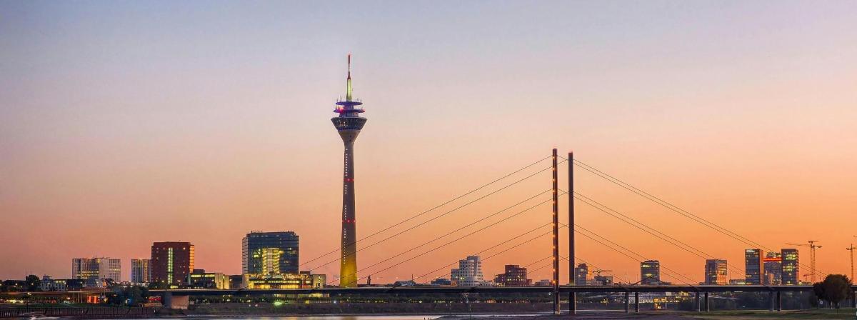 a view of a tv tower in a city