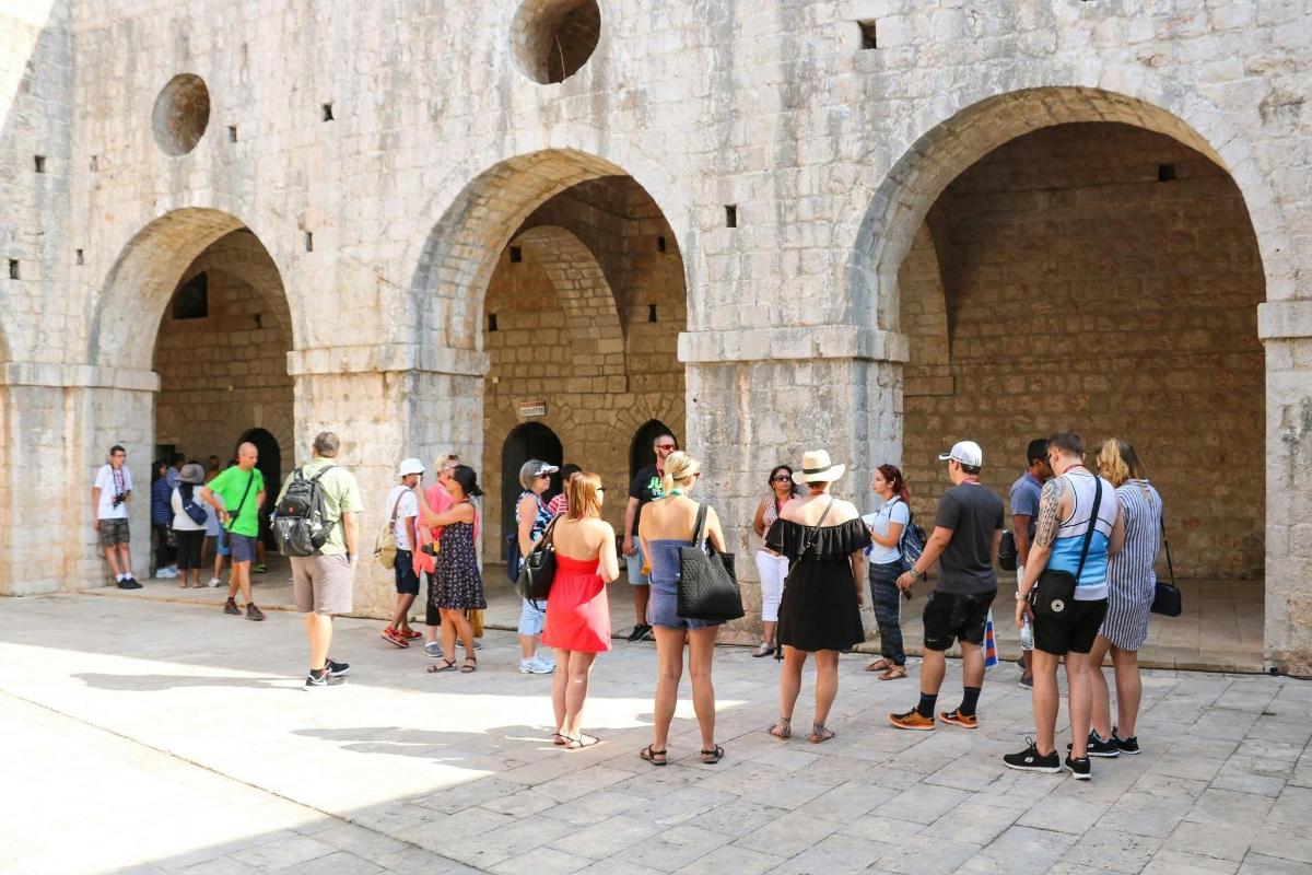 a group of people standing in front of a building