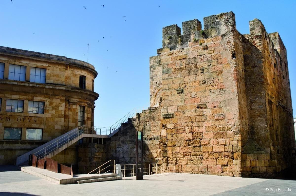 a large brick building with a staircase next to it