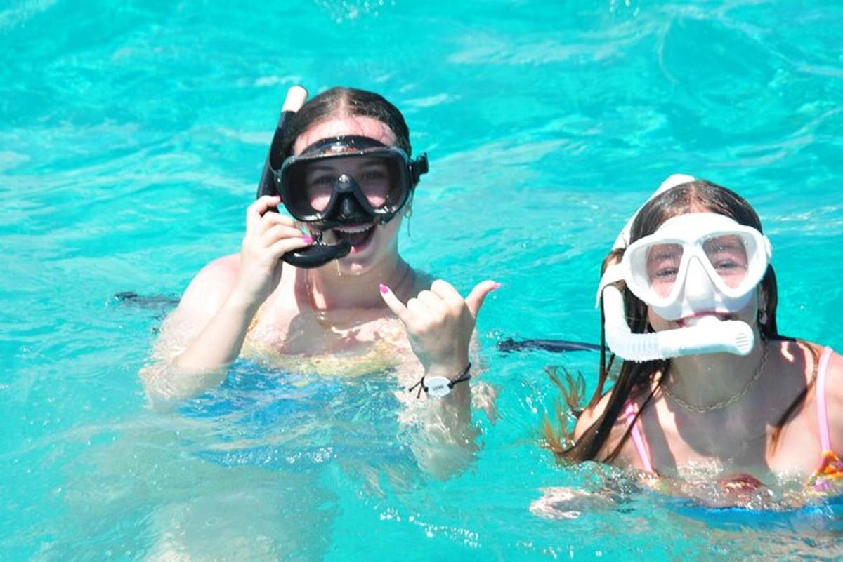 two people in the water with a snorkel