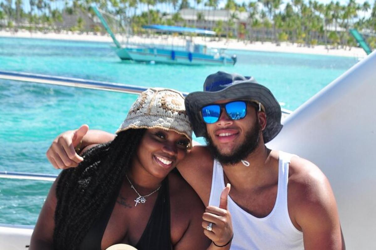 a man and woman posing for a picture on a boat