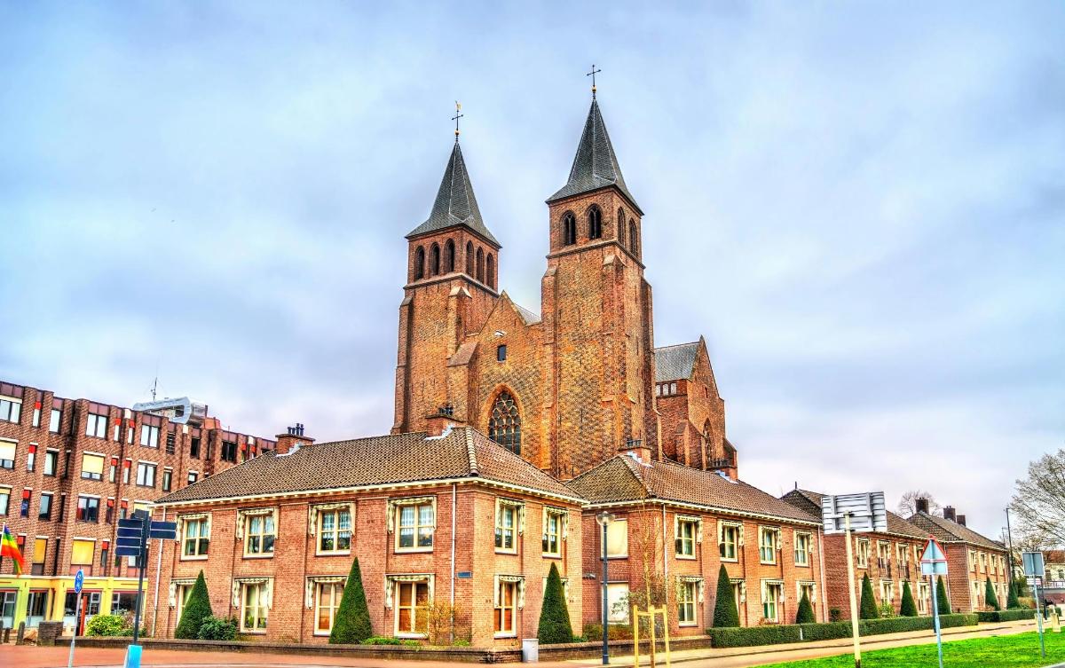an old brick building with a tower on top of it