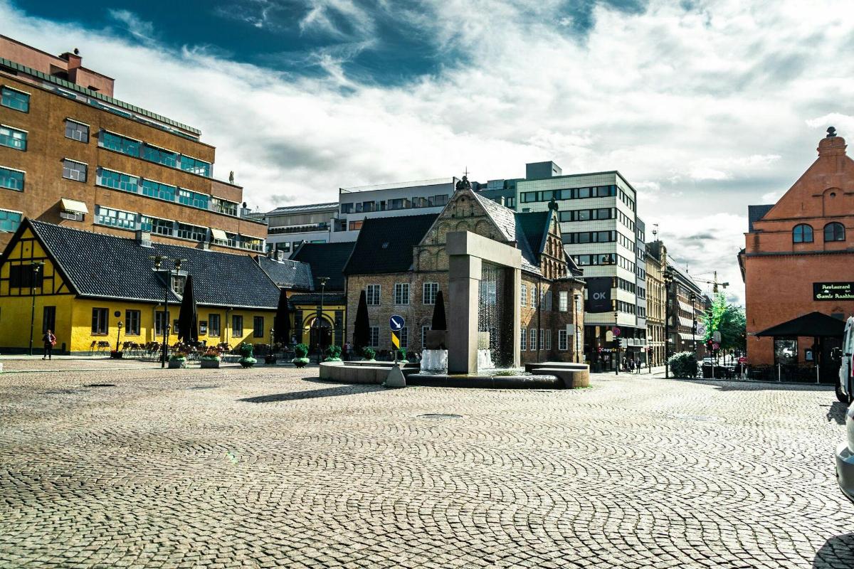a city square with a church and buildings