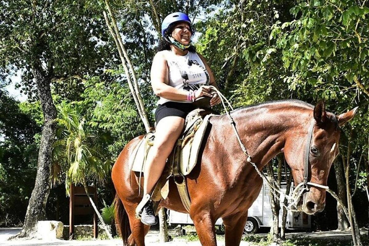 a woman riding on the back of a horse