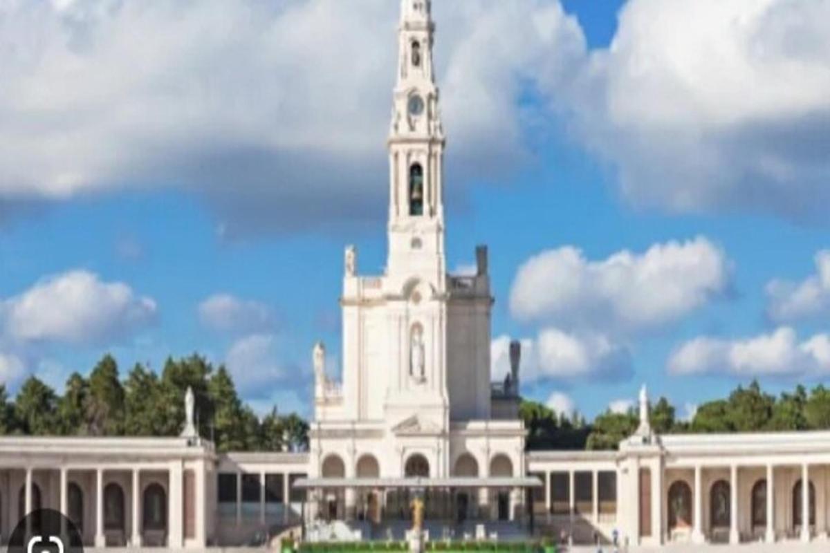 a white building with a tower on top of it
