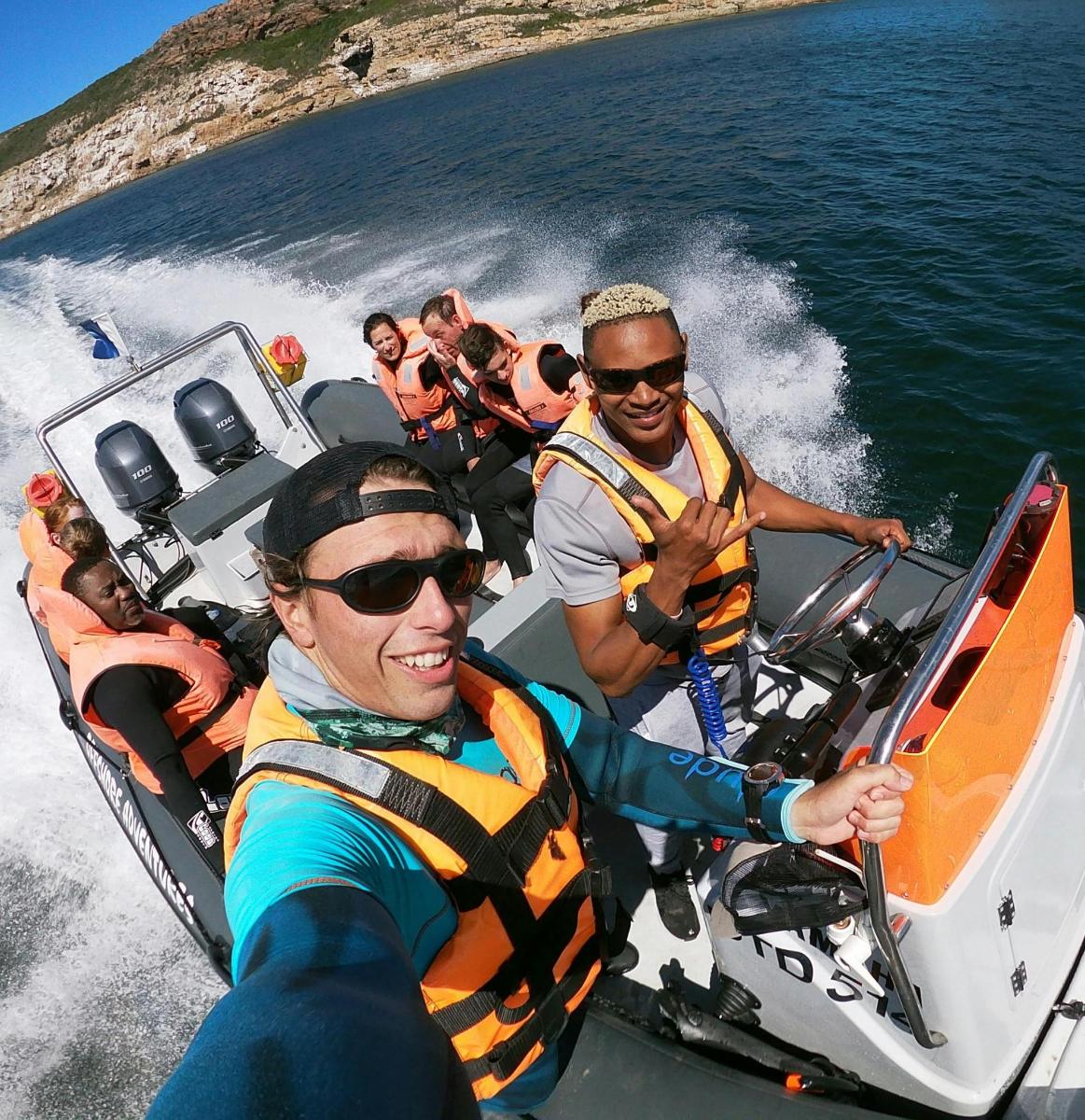 a group of people on a boat in the water