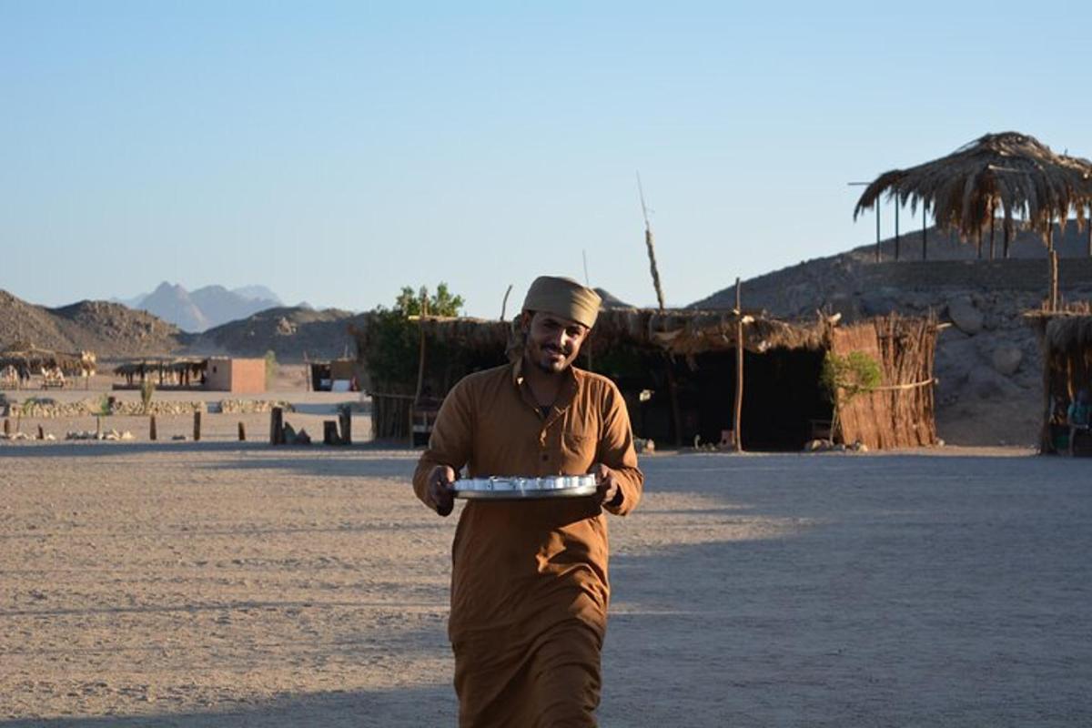 a man standing on a beach holding a frisbee