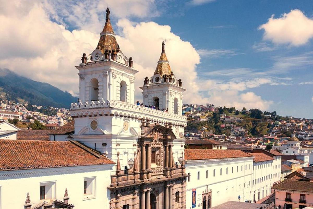 a building with two towers on top of a city