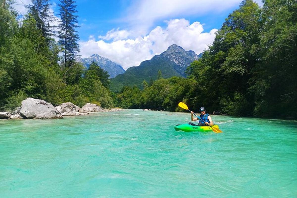 a person is kayaking down a river with a paddle