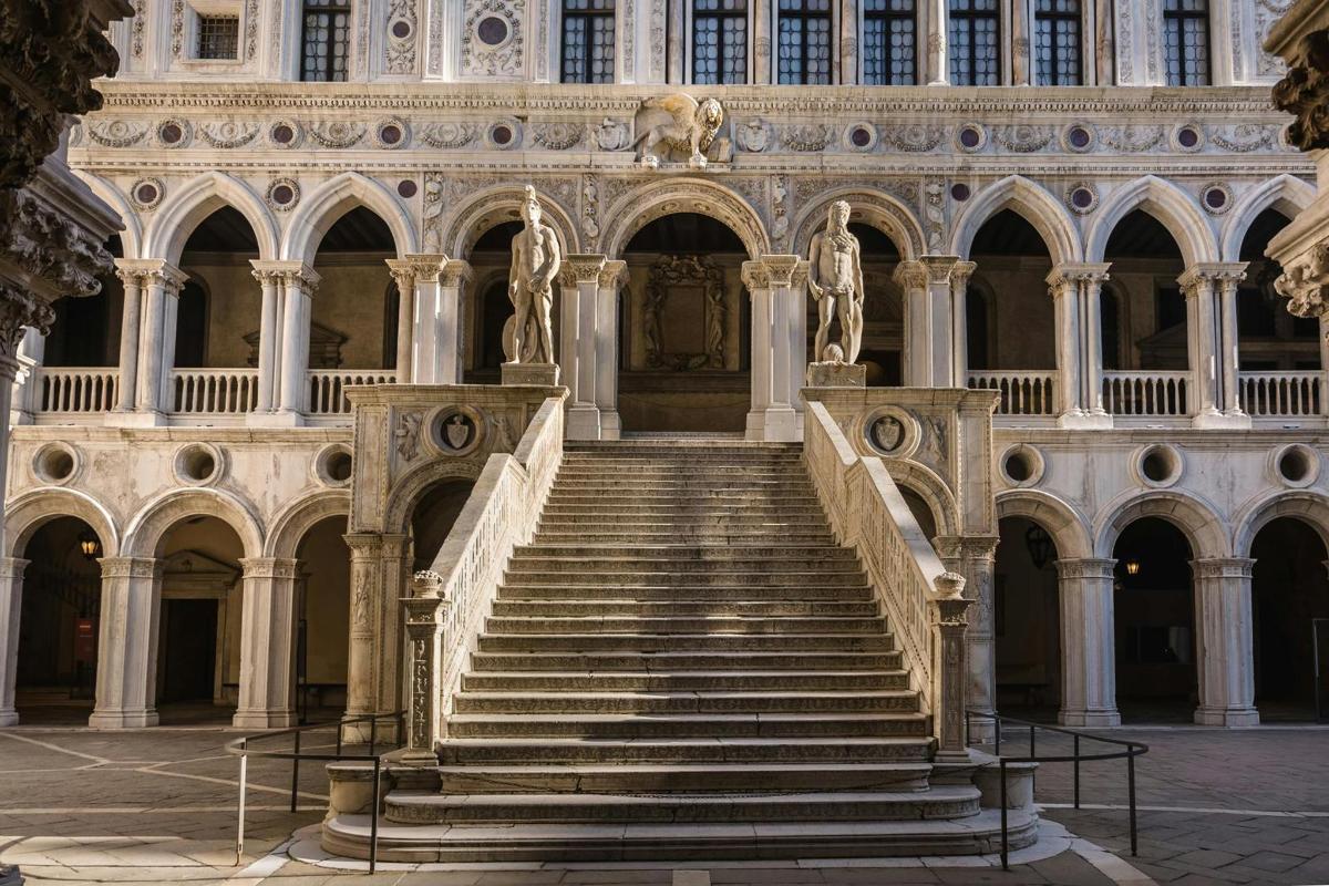 a set of stairs in a building with a statue