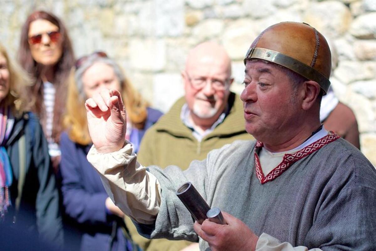 a man with a crown on his head holding a cell phone