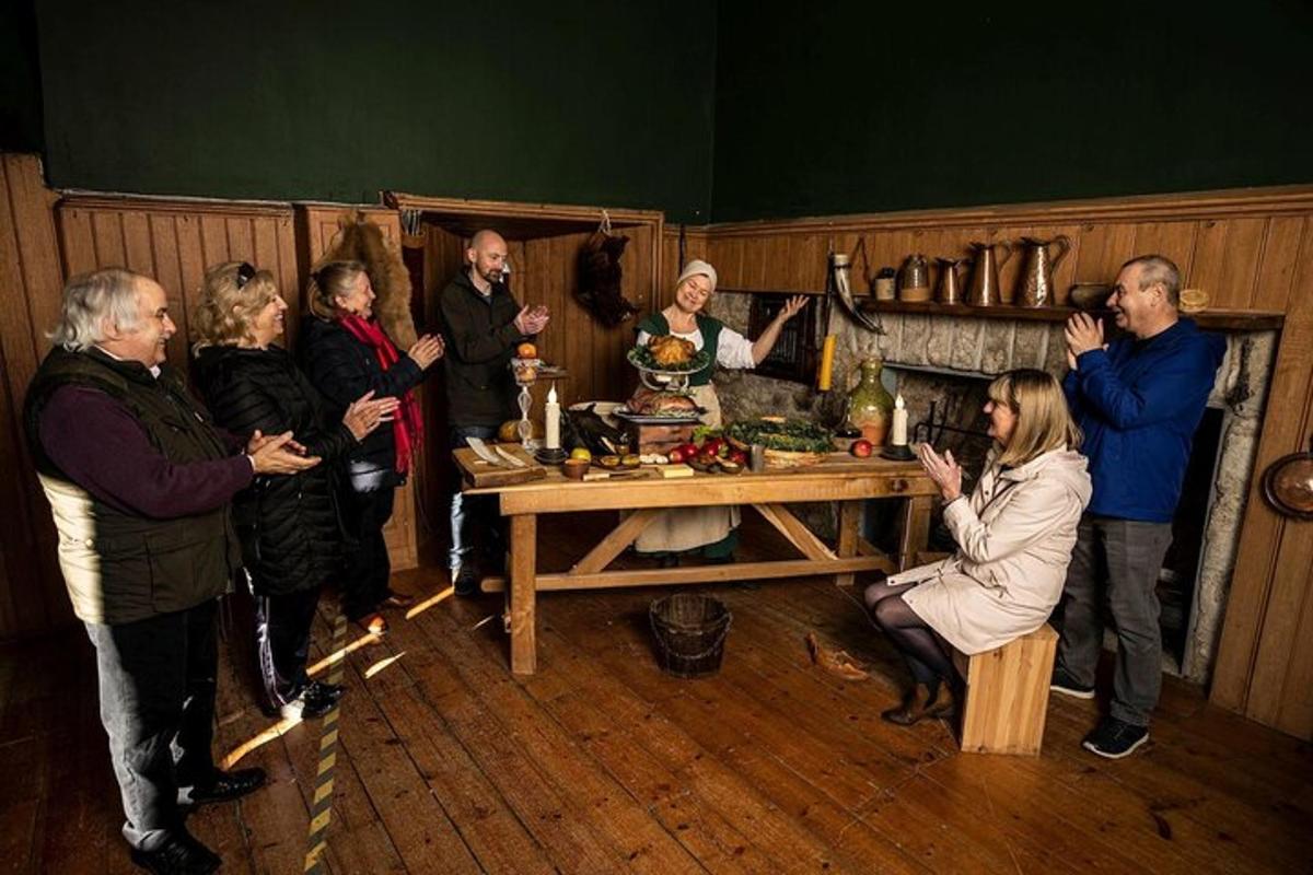 a group of people standing around a table in a room