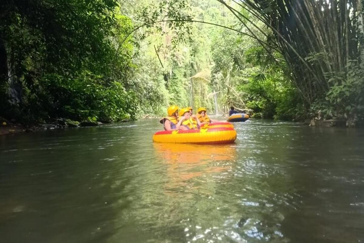 a group of people riding on a raft on a river