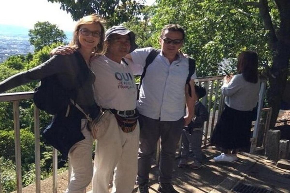 a group of three people posing for a picture