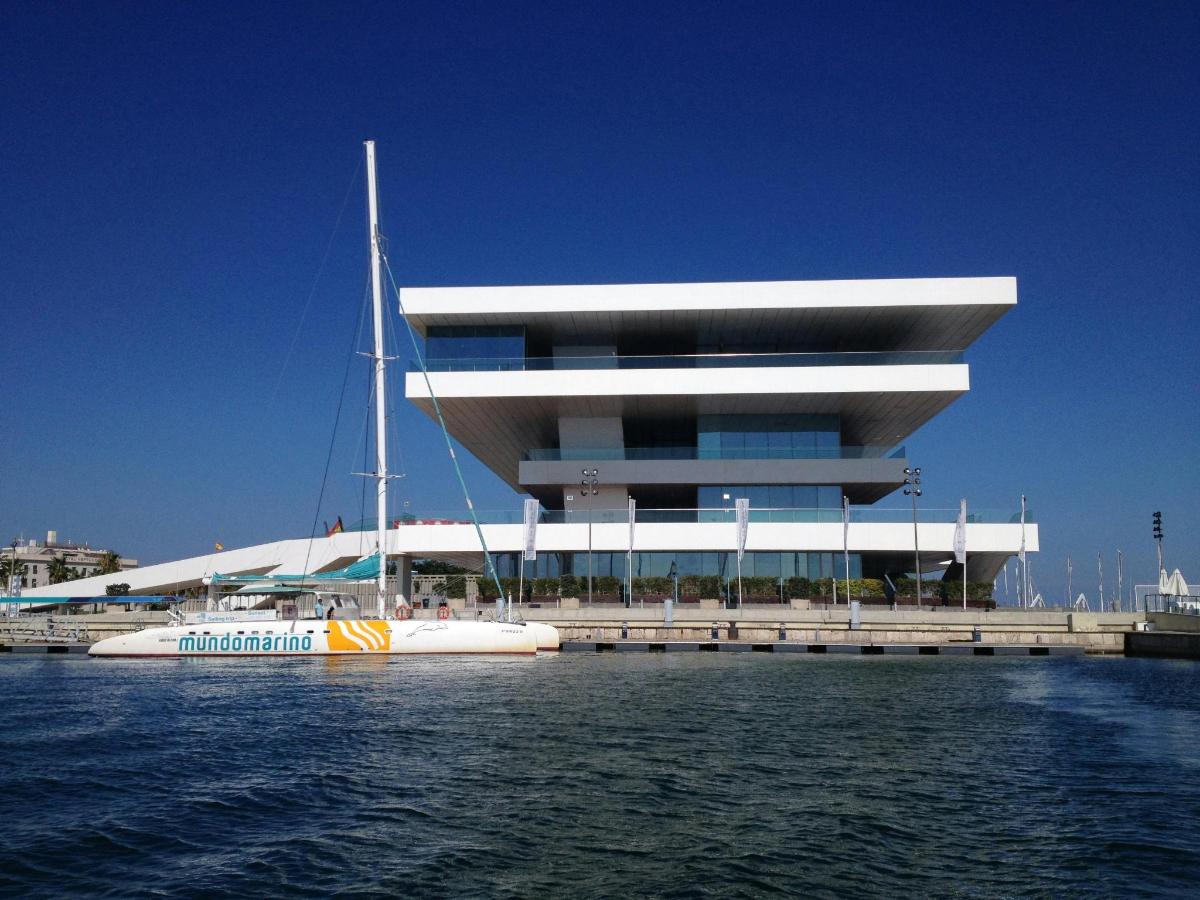 a large building with a boat in a body of water