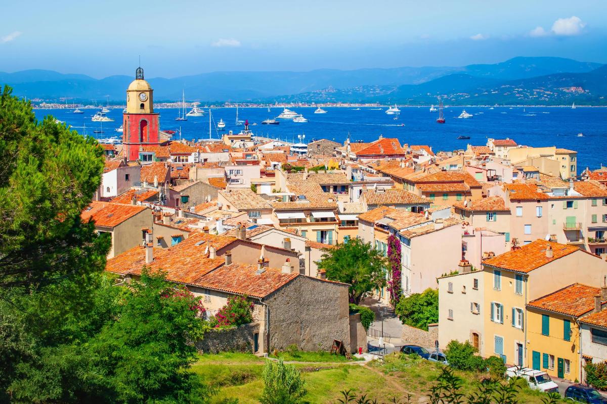 a cityscape of a town with a clock tower