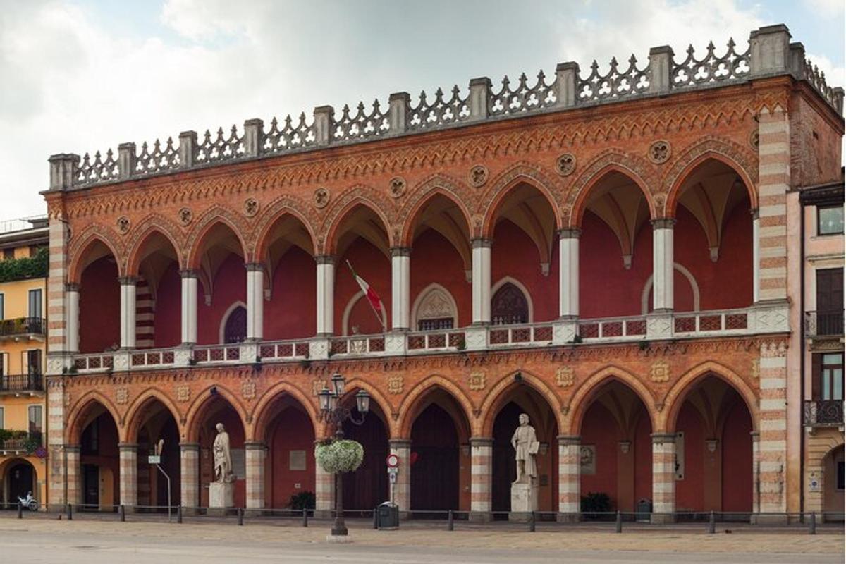 a large red brick building with arches