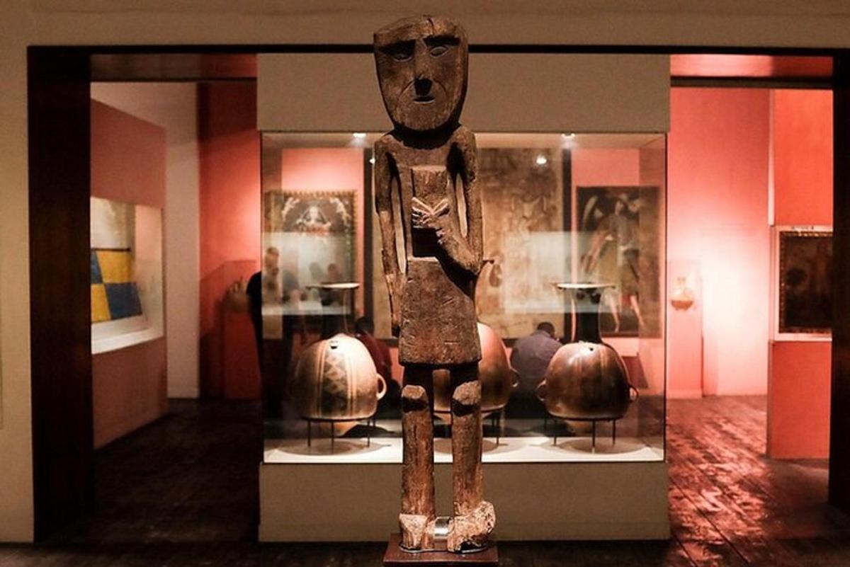a statue in a display case in a museum