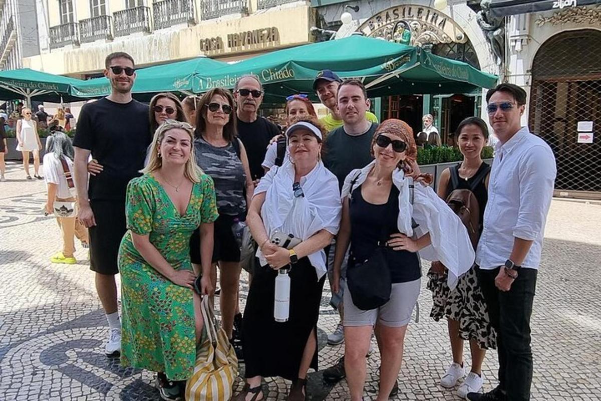 a group of people posing for a picture on a street