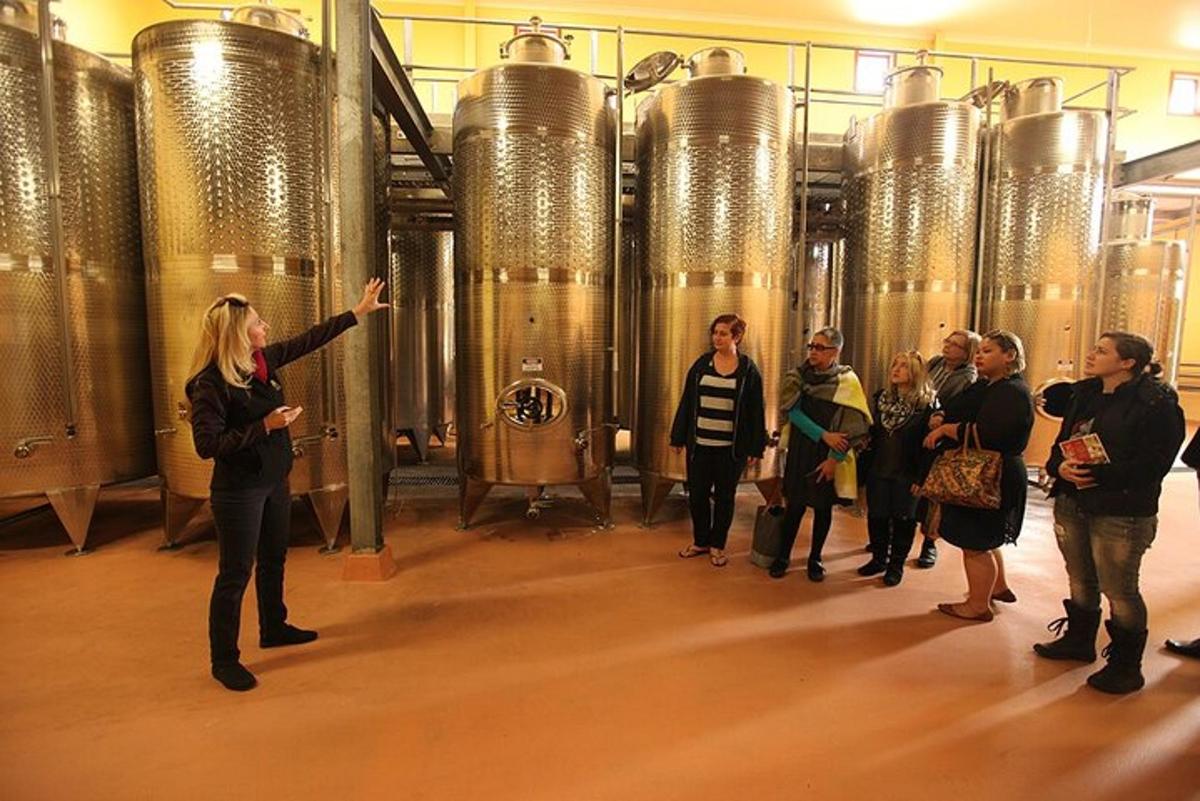 a group of people standing in front of a brewery