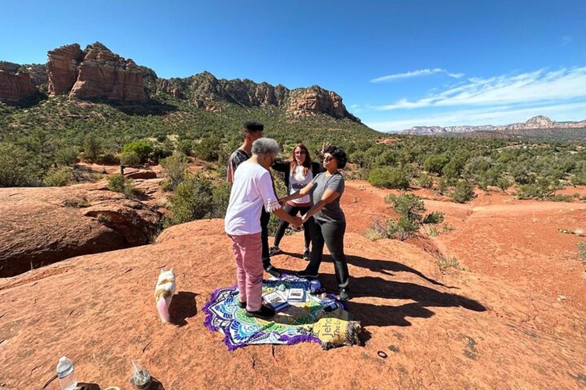 a group of people standing on top of a mountain