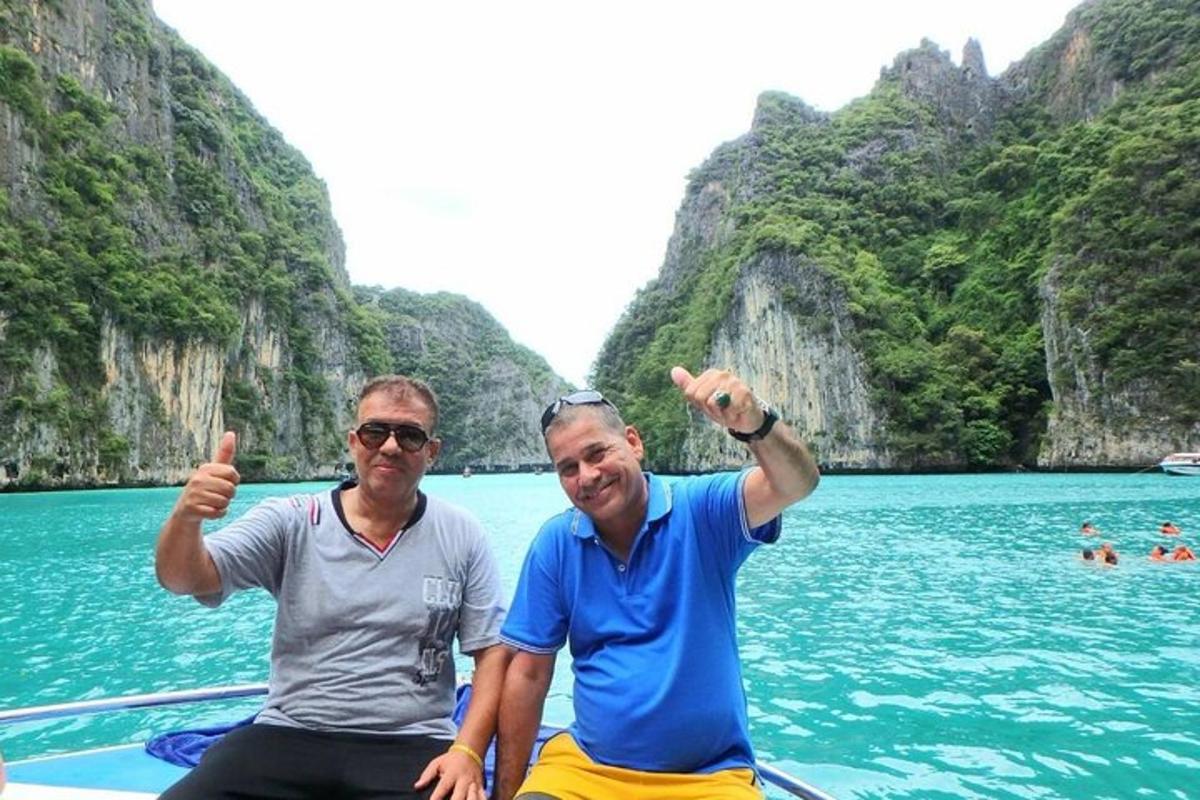 two men sitting on a boat in the water