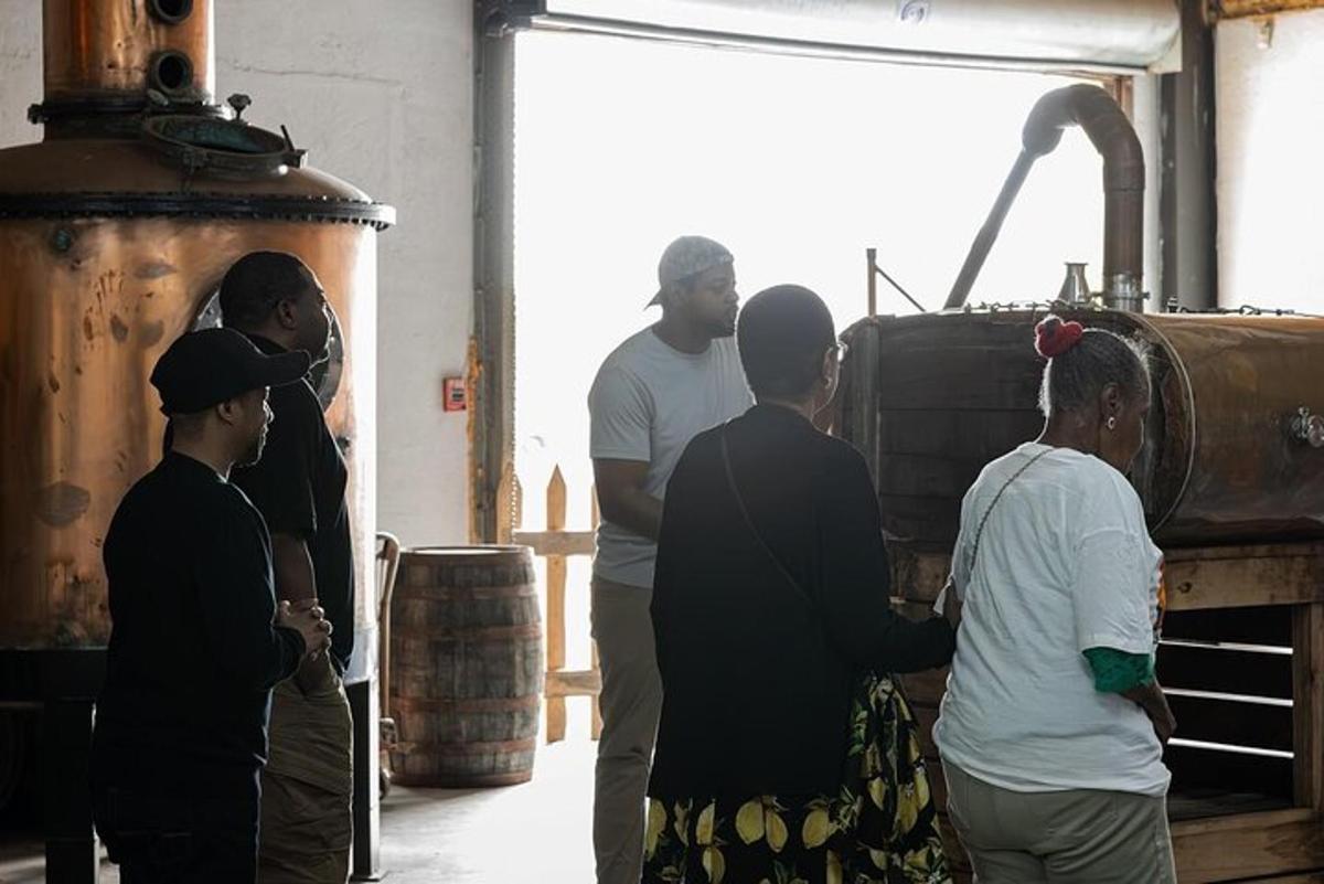 a group of men standing in a brewery with barrels
