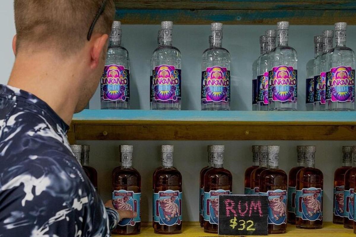 a man is looking at a display of bottles of alcohol