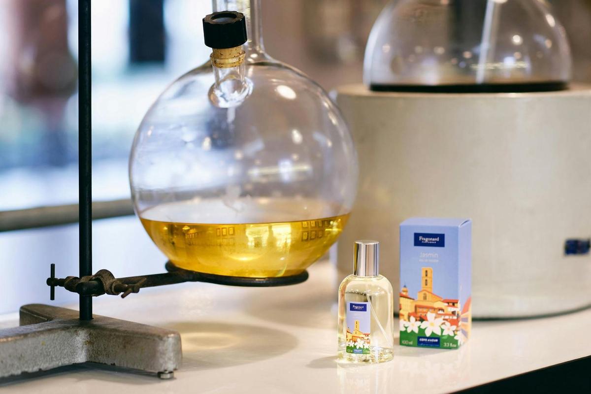 a glass bowl filled with oil sitting on top of a counter