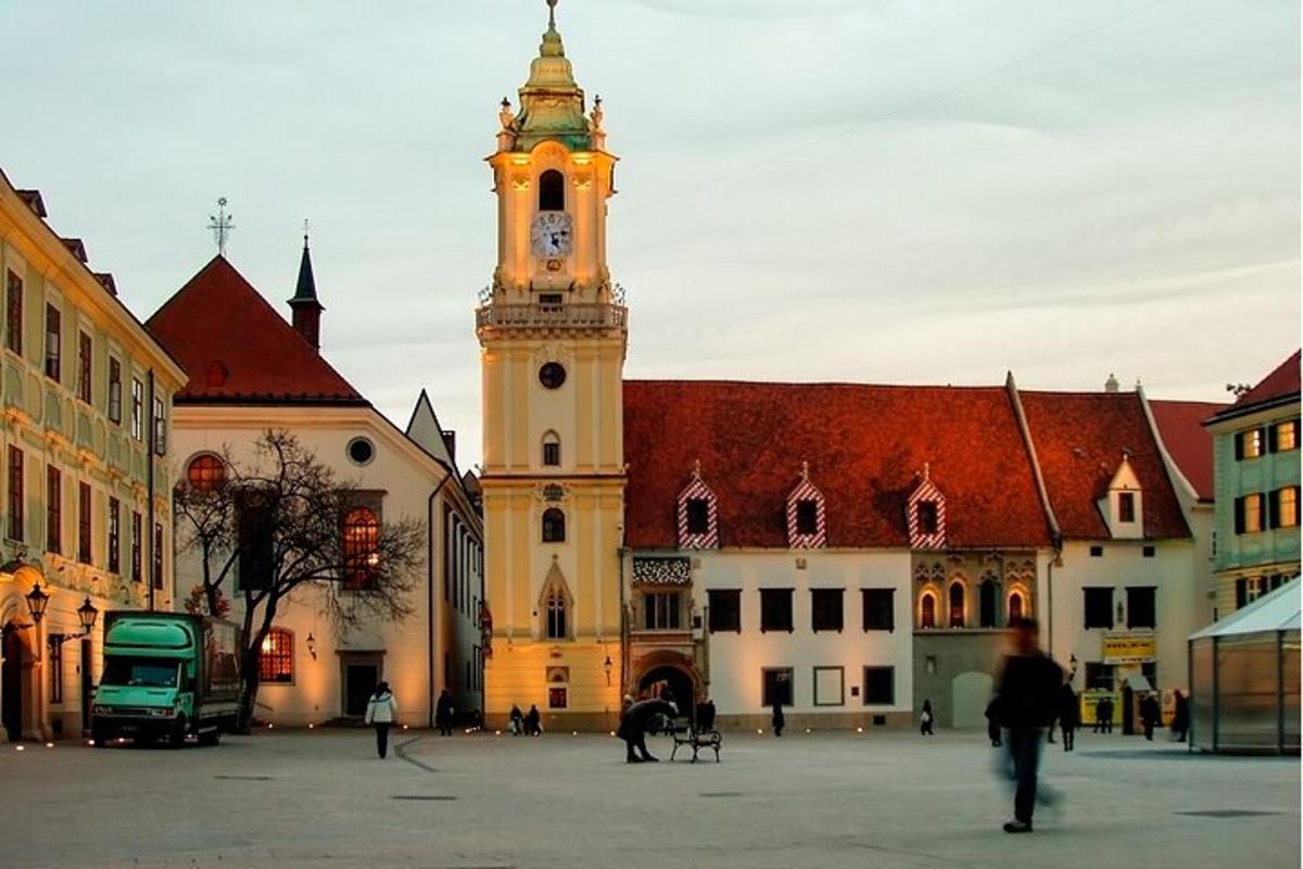 a large building with a clock tower in a city