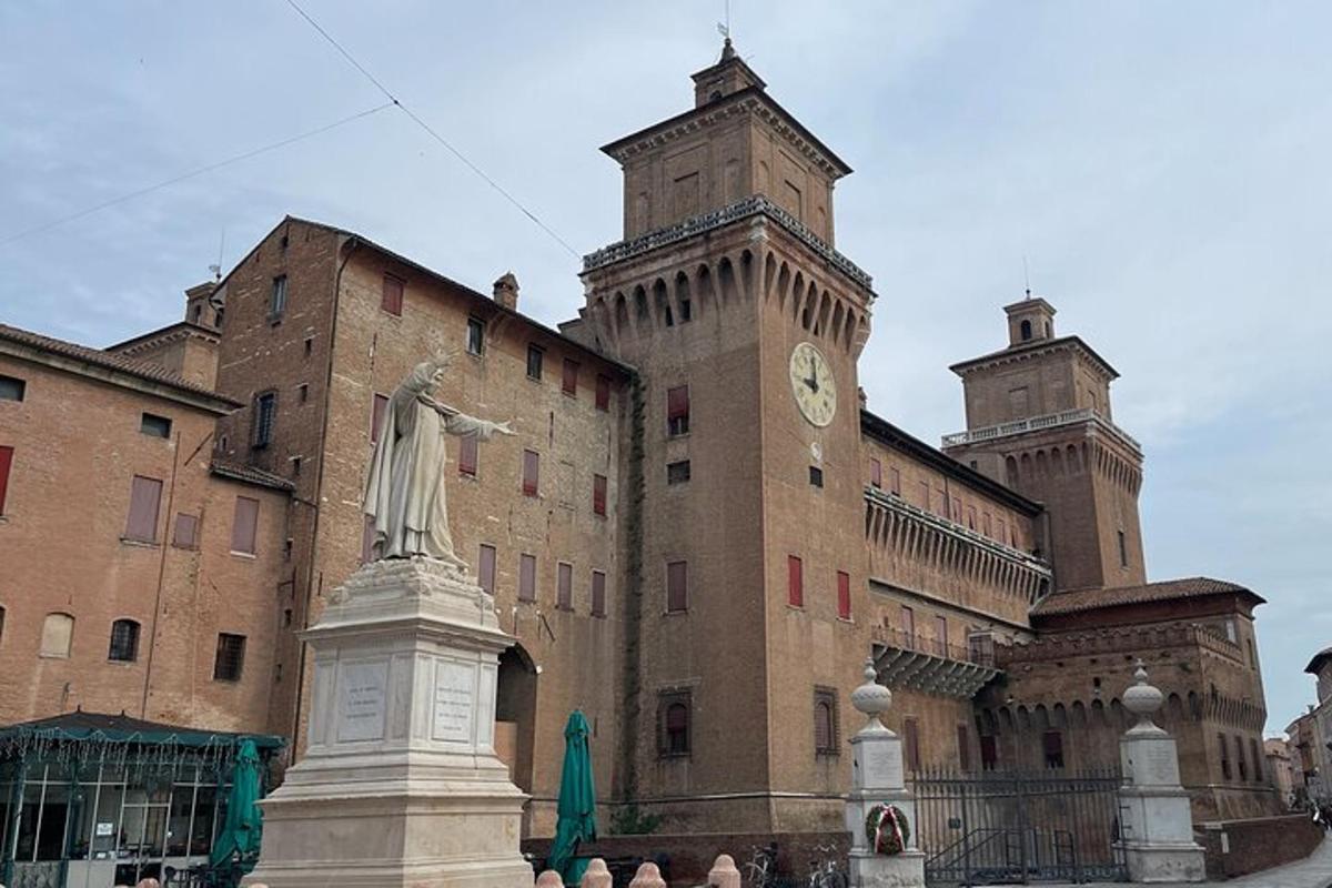 a large building with a statue in front of it