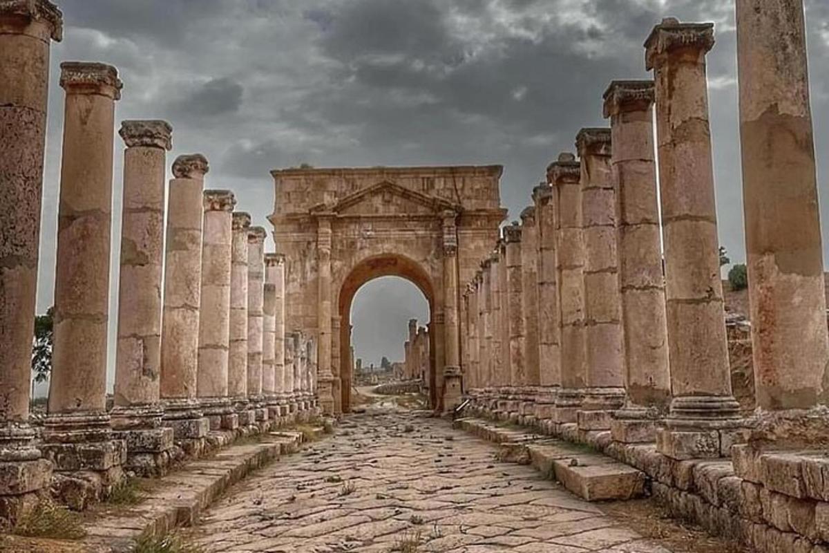 an archway in an ancient building with columns