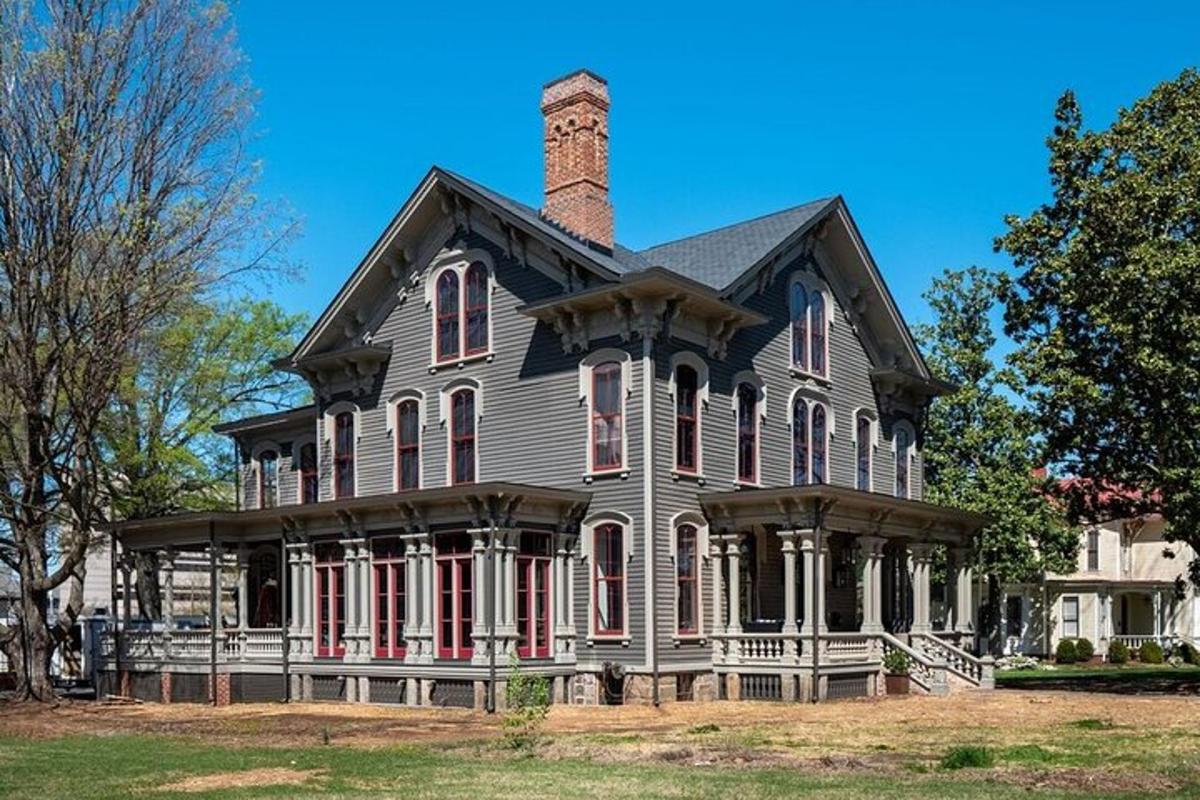 an old house with a chimney on top of it