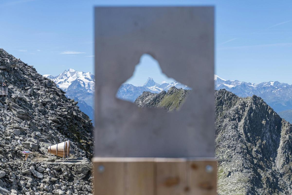 a view of a mountain with a reflection of a mountain