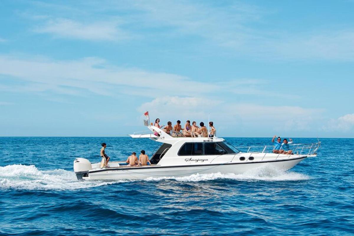a group of people on a boat in the ocean