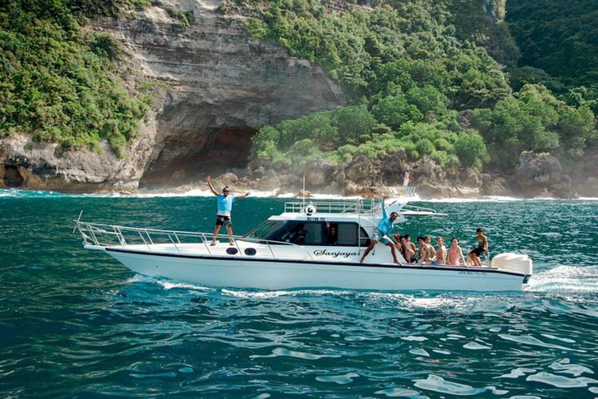 a group of people on a boat in the water