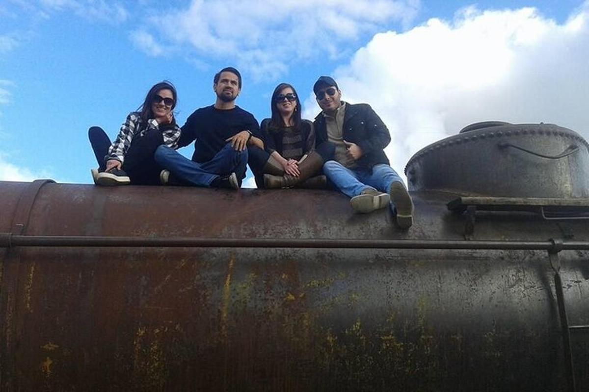 a group of people sitting on top of a tank