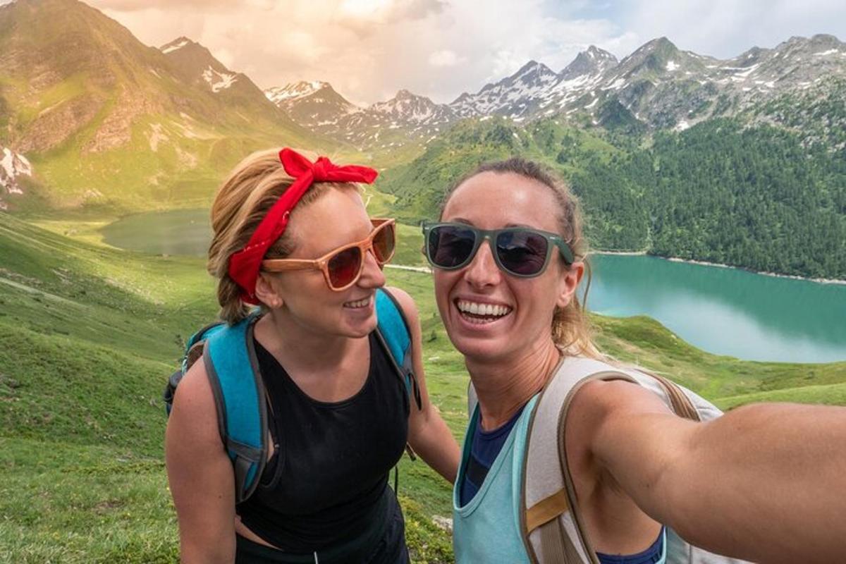 two women standing on top of a mountain