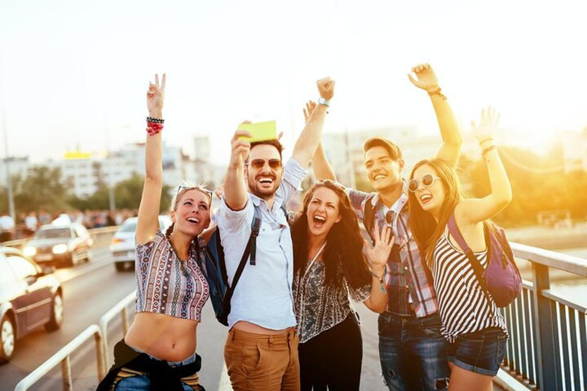 a group of people with their hands in the air