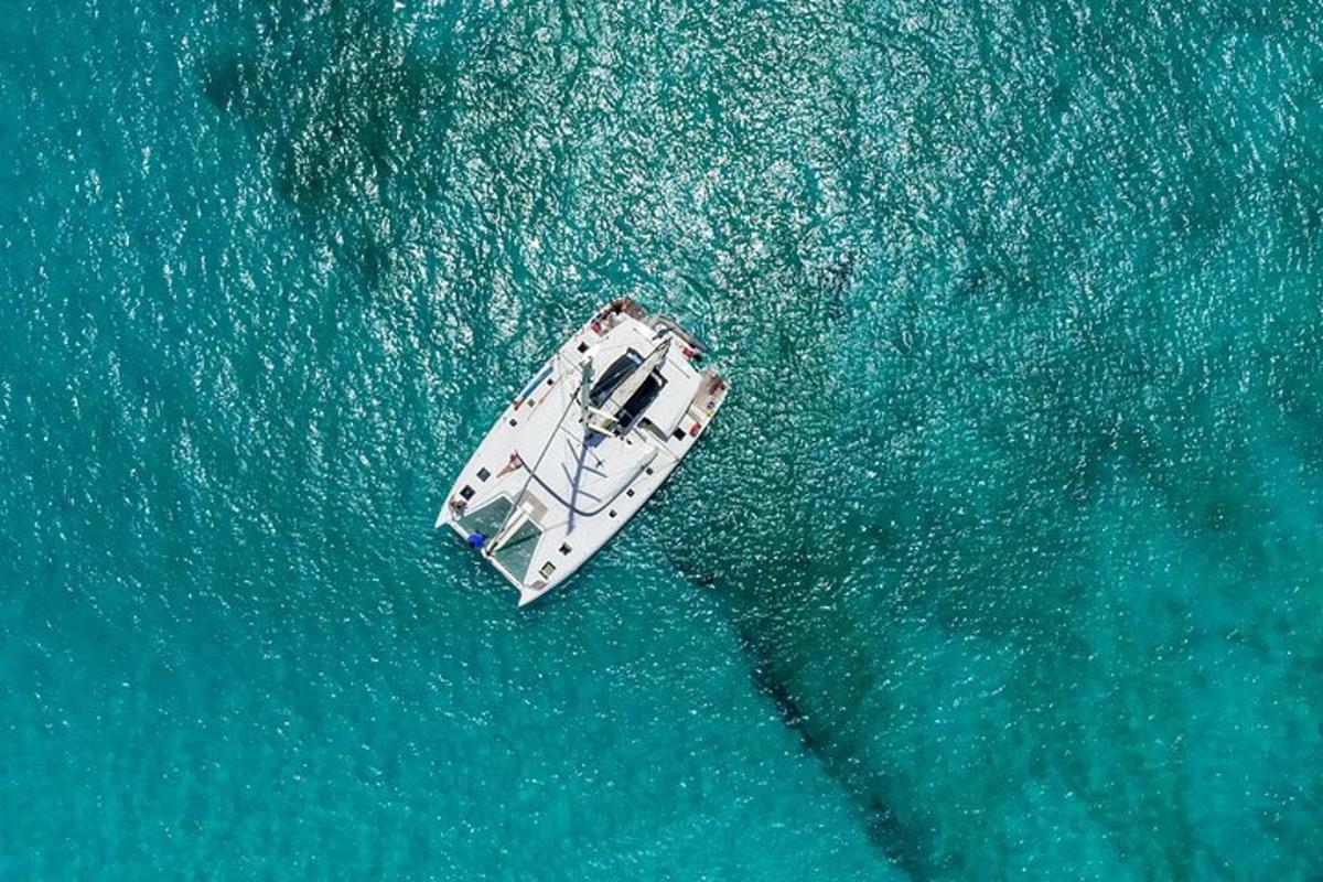 an aerial view of a boat in the water