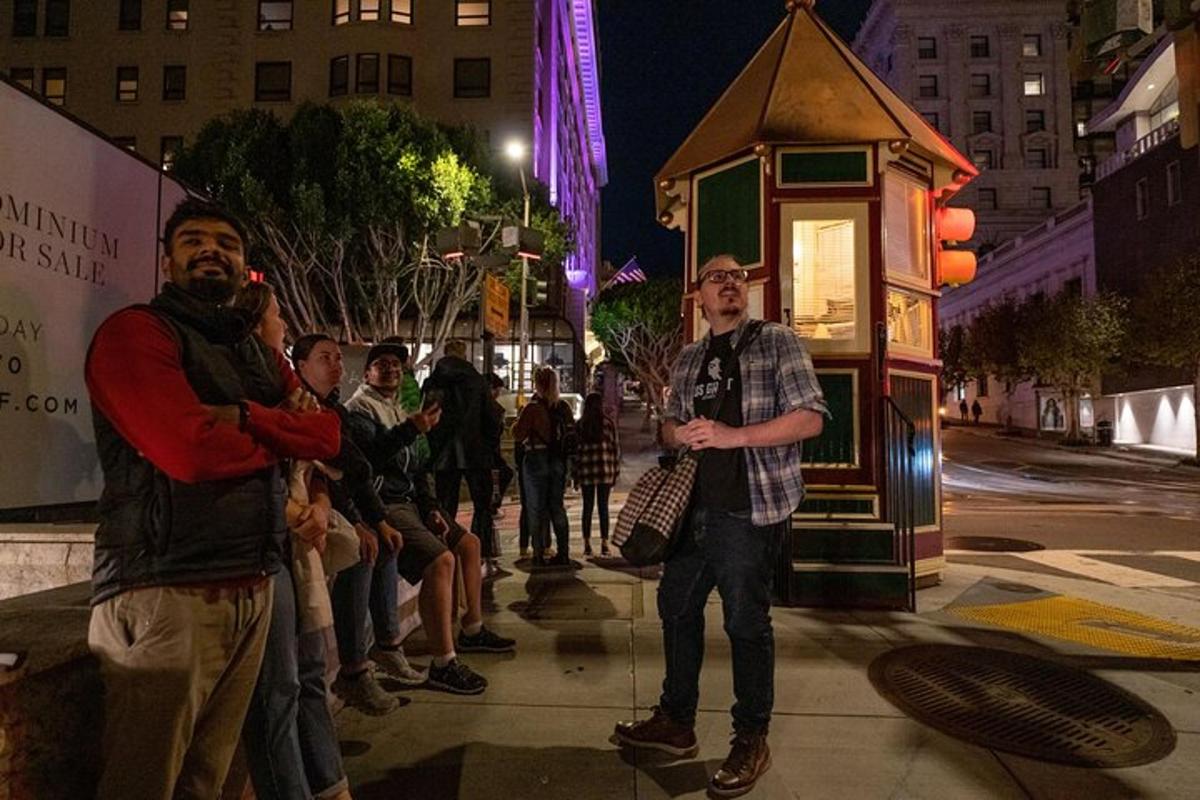 a group of people standing on a street at night