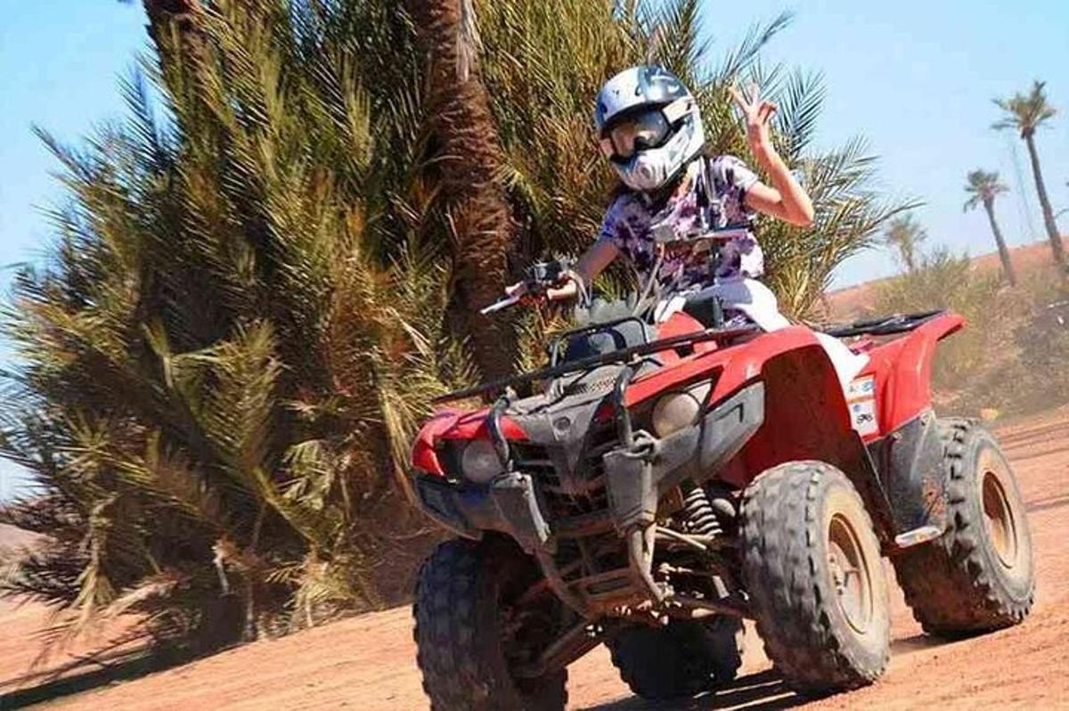 a person riding a wheeler on a dirt road