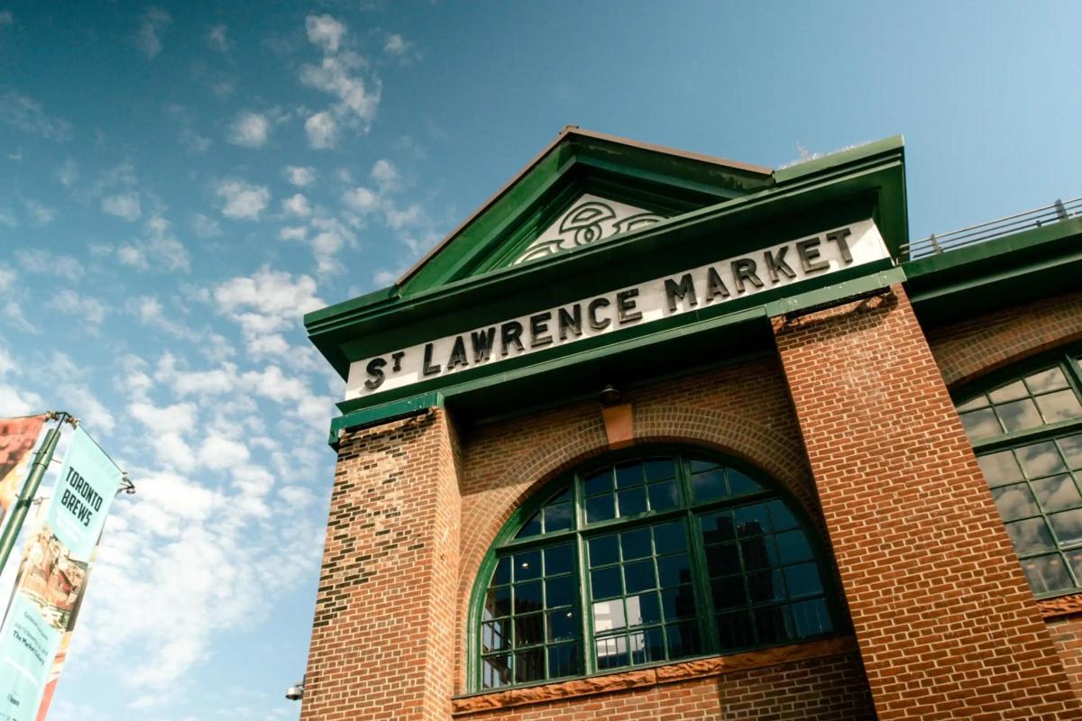a building with a sign that reads stnance market