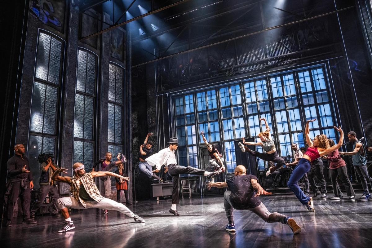 a group of people dancing on a stage