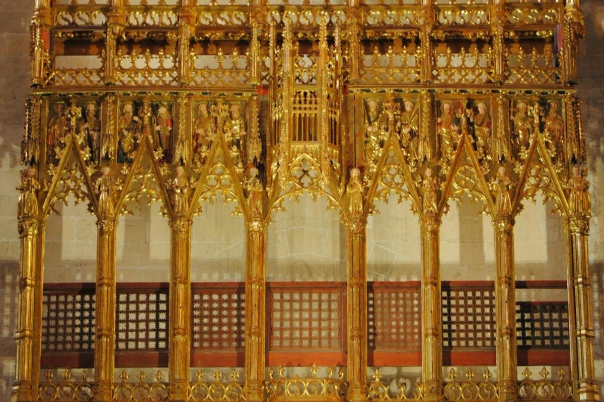 a close up of a large gold fence