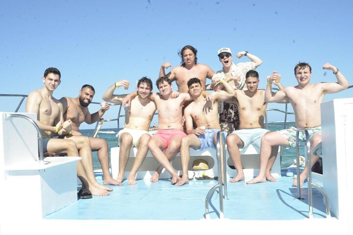 a group of men sitting on a boat