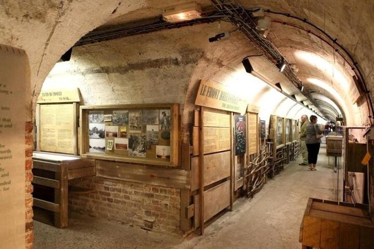 a hallway in an old train station with people walking around